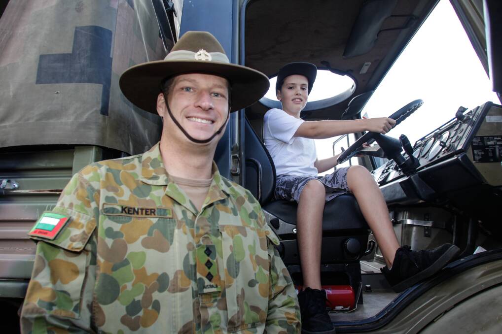 B Company Wollongong Depo Officer Commanding (OC) Nic Kenter with Kade Hall, 10 at the Army Reserve Open Day. Picture: Georgia Matts
