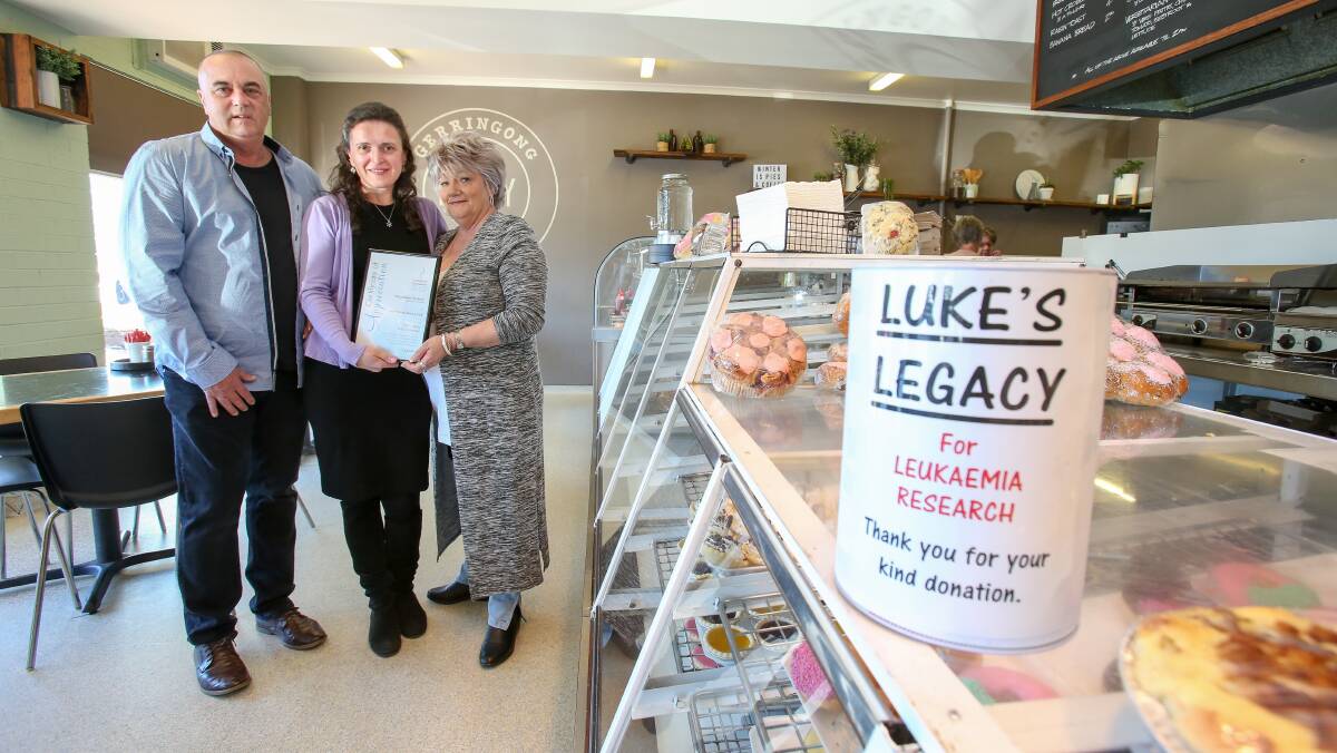 Funds for research: Gerringong Bakery and Cafe owners Len and Annette Fownes handed over a cheque for $10,000 to Nina Field from the Leukaemia Foundation this week. Picture: Adam McLean