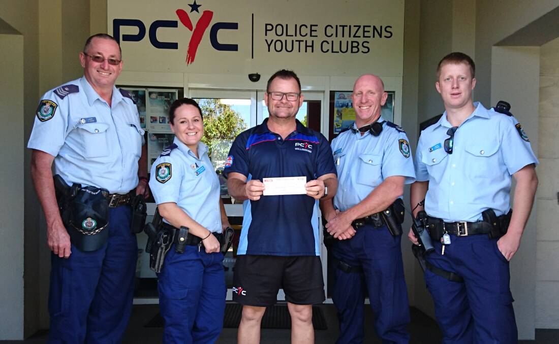 Funding boost: Sgt Bob Minns, Wollongong LAC; Senior Constable Cate Johnston, PCYC manager Michael Jones,  Senior Constable Darren Paul – all from PCYC and Constable Shane Moore, Wollongong LAC.