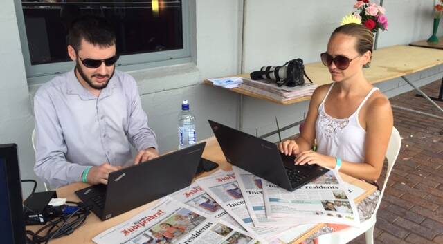 Intrepid reporters Brendan Crabb and Hayley Warden putting out the paper from the Kiama Show.