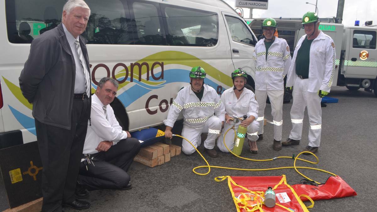 Narooma Sporting and Services Club board chairman Graham Reeve and general manager Tony Casu get a demonstration of the new air bags from Narooma VRA rescue squad volunteers Mal Barry, Suzy Cooper, Paul Coker and Grant Harrison.
