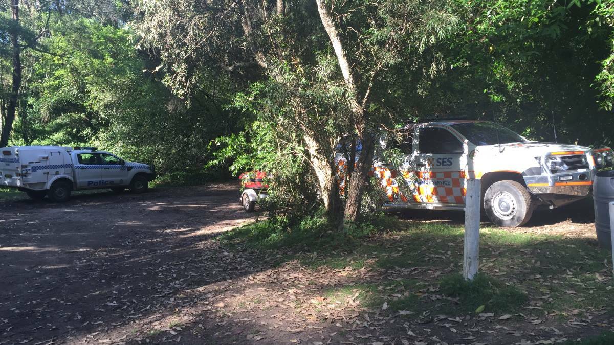 Emergency services at Coolendel camping ground on the weekend during the search for a young man who disapeared while swimming.