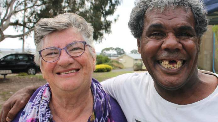 WE ARE ONE: Robyn Thorpe and Ray Doyle, both of Eden, at the Harmony Day 2017 community barbecue held in the grounds of the Uniting Church in Eden on Tuesday. Picture: Liz Tickner

