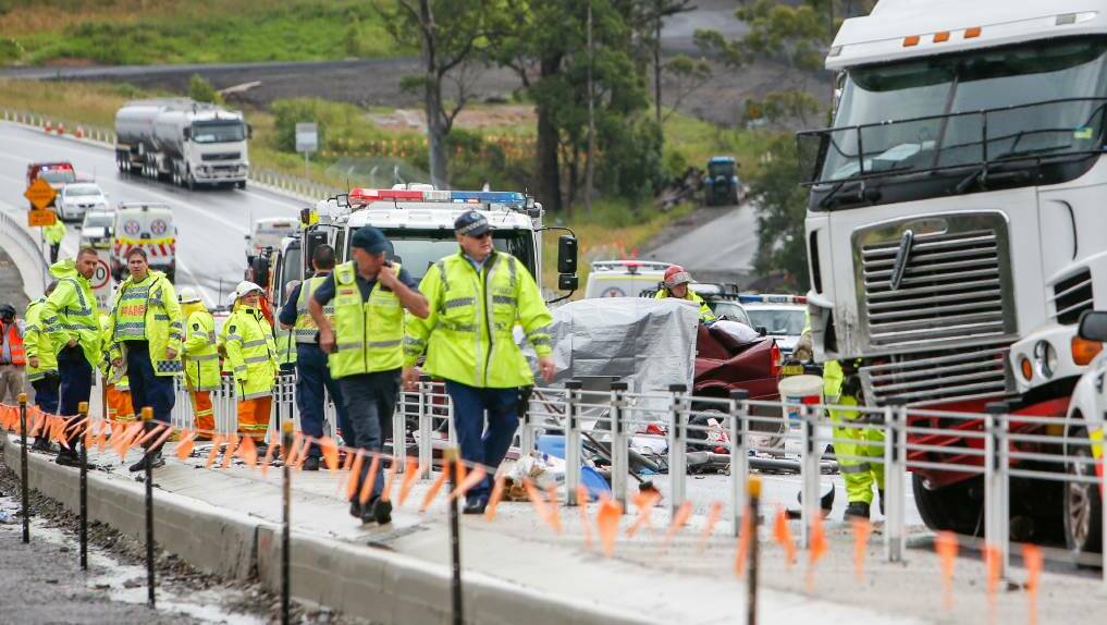 Emergency services at the crash site on the Princes Highway north of Berry. Photo: Adam McLean
