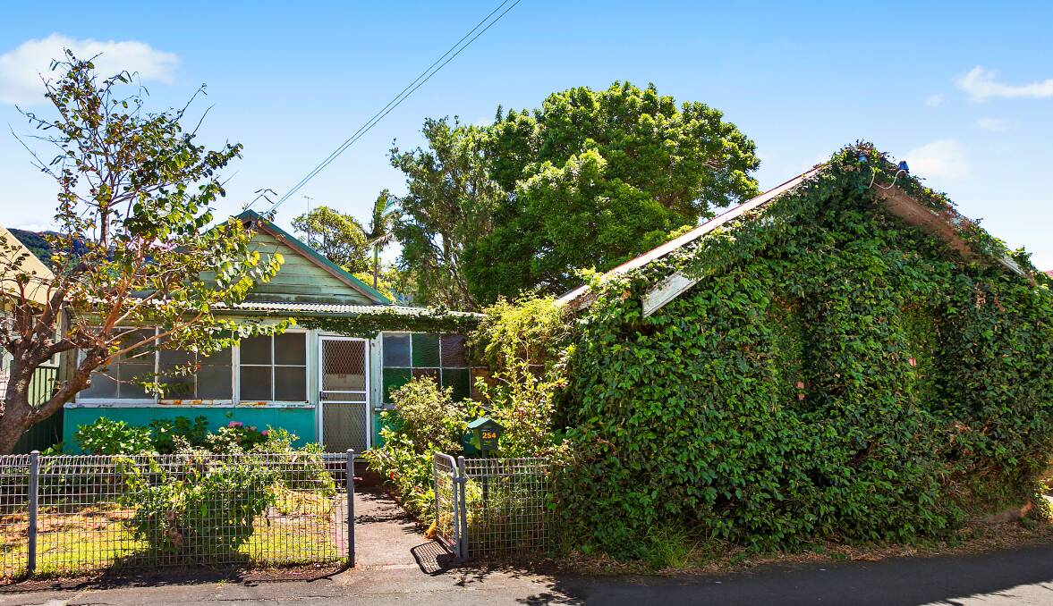 THIRROUL GREEN HOUSE: This distinctive ivy covered property at 254 Lawrence Hargrave Drive, next to the post office and right in the heart of Thirroul village, has plenty of potential for a creative buyer. Picture: Supplied