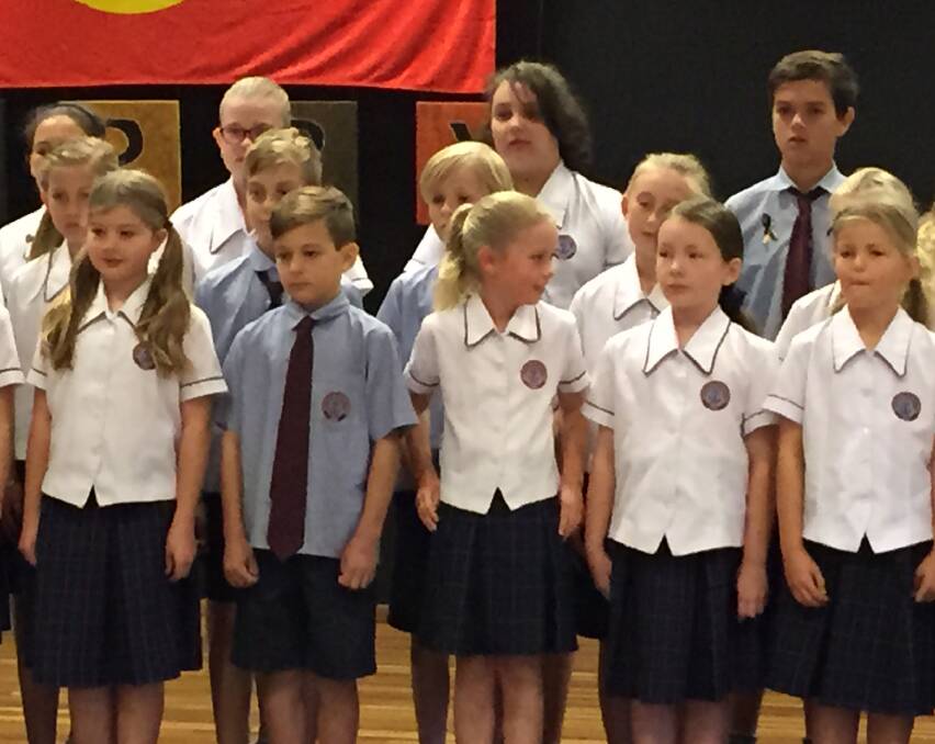 SORRY DAY: Ss Peter and Paul Catholic Primary School, Kiama students performing during the ceremony at The Pavilion. Picture: Brendan Crabb 