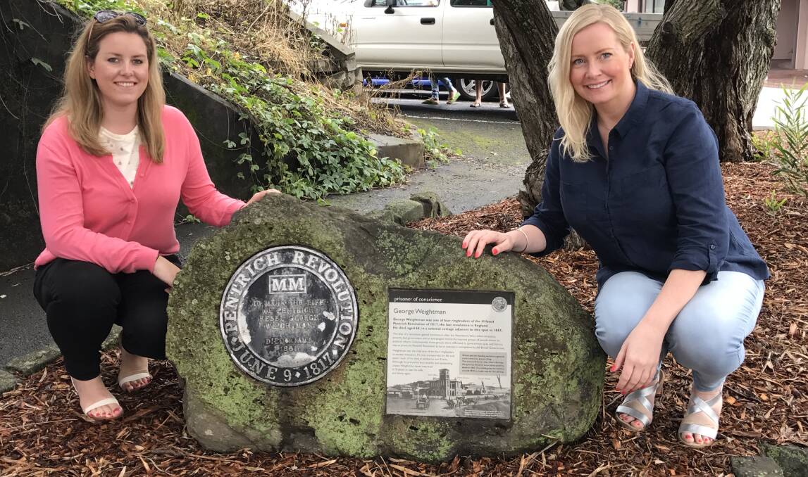 HISTORY: Sisters Kate and Rebecca Weightman visiting the plaque dedicated to their relative while in Kiama. Picture: Brendan Crabb