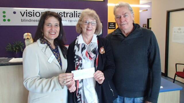 DONATION: Alex Collins, regional manager for Vision Australia Wollongong with Denise Williams and Col Rathbone.