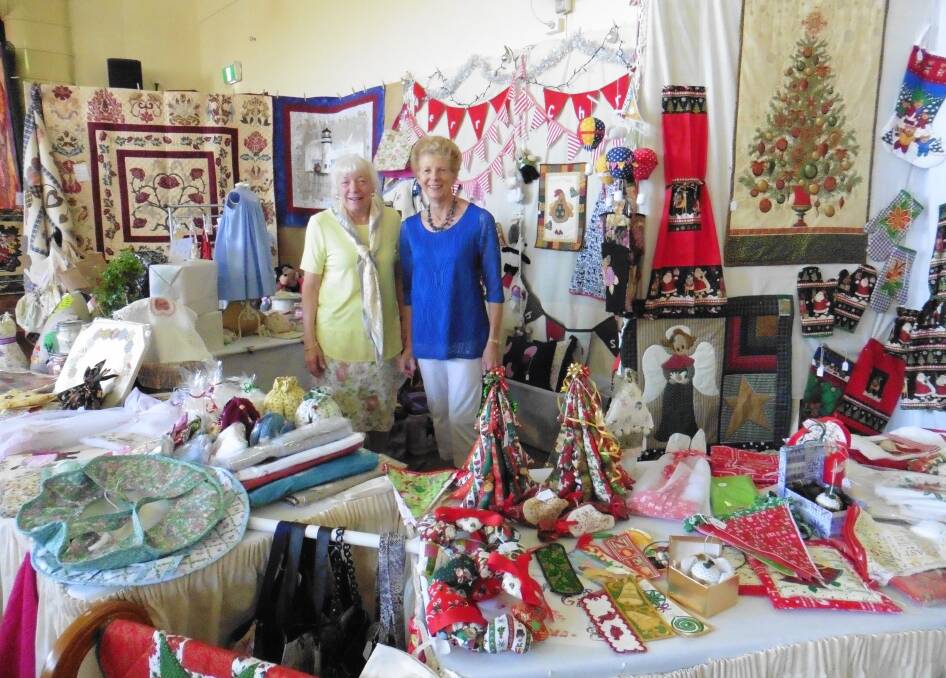 SHOW TIME: CMRI members Gwen Wishart (left) and Sue Dmetreson amid the hand- made goods for sale at last year’s craft stall. Picture: Supplied