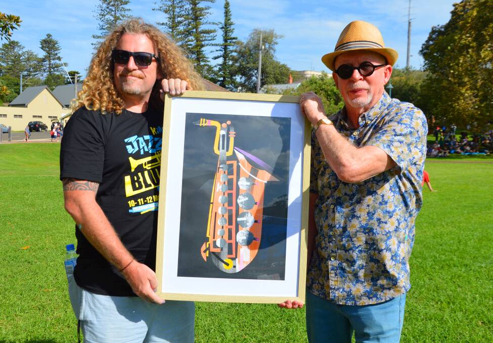 RECOGNITION: Kiama artist Mikey Freedom makes a presentation to Ross Eggleton. Picture: Supplied