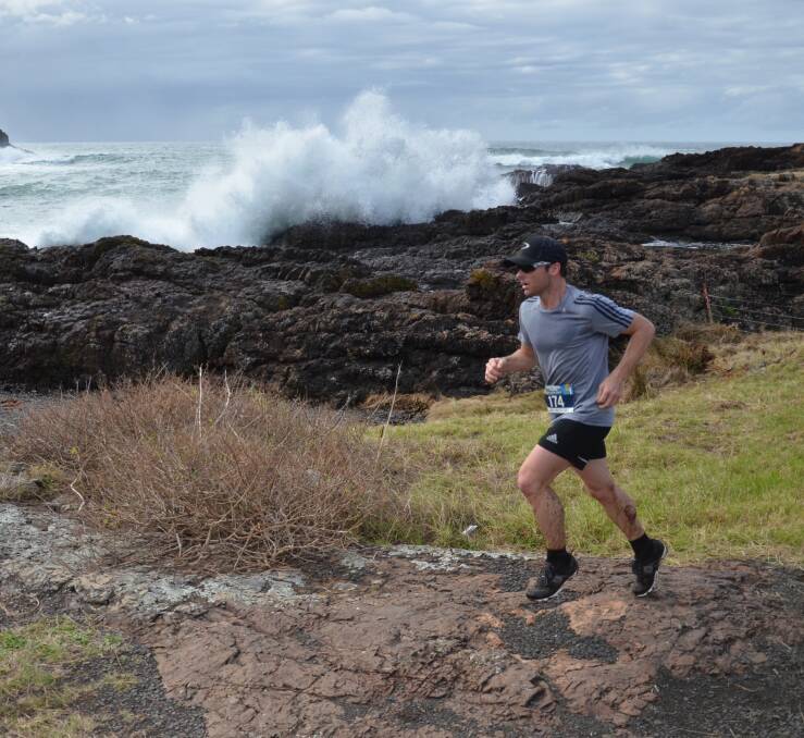 RUNNING: A competitor enjoying the scenic surrounds during the Kiama Coastal Classic fun run on the weekend. Picture: Supplied