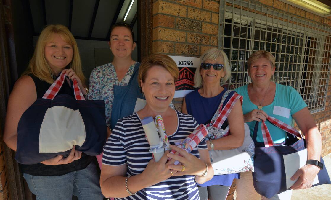 MOVEMENT: Stacey Scott, Camilla Kerr-Ruston, Josephine St John (Kiama council), Marg Dowel and Gail Brooks moving into the new headquarters for Kiama Boomerang Bags at Illuka Reserve tennis clubhouse. Picture: Supplied