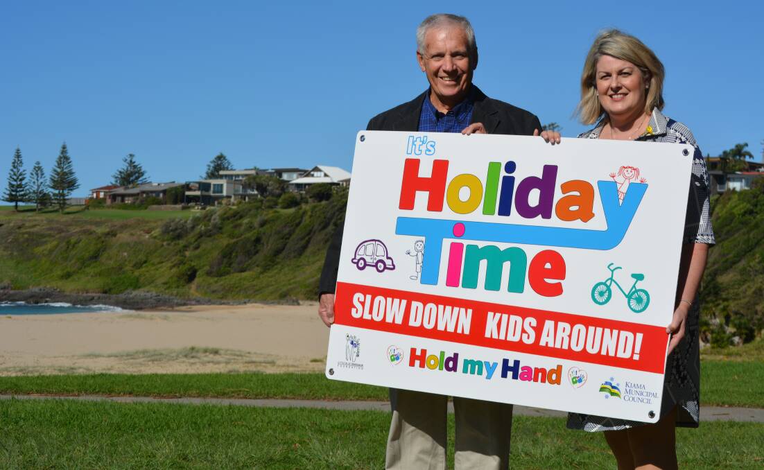 Kiama Mayor Brian Petschler with child pedestrian and roadside safety advocate Michelle McLaughlin of the Little Blue Dinosaur foundation at Kendalls on the Beach Holiday Park. 