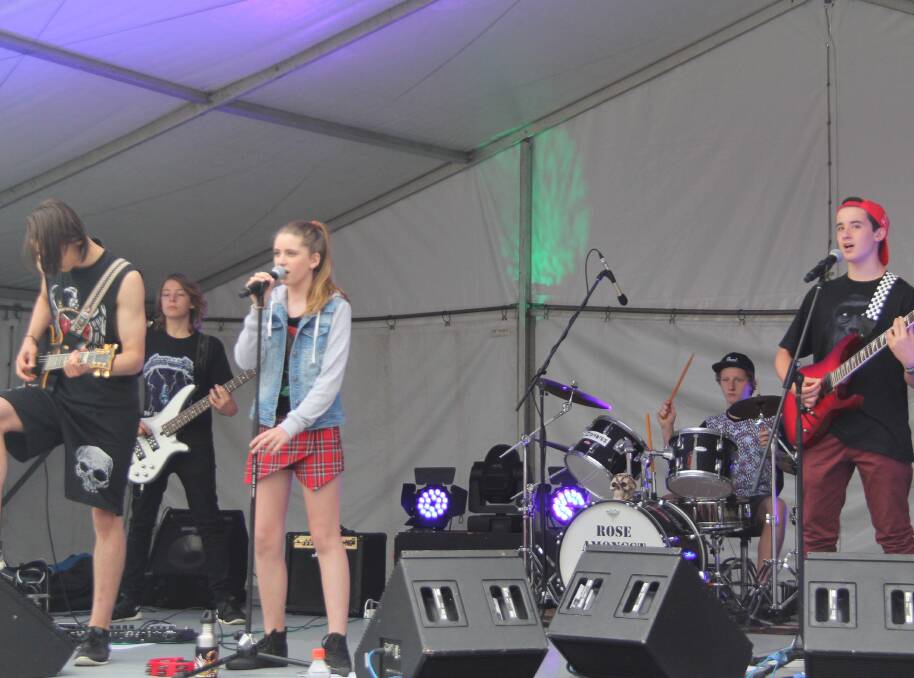 ROCK BAND: Jamberoo outfit Rose Amongst Thorns performing recently in front of a large crowd at Run Wollongong. Picture: SUPPLIED