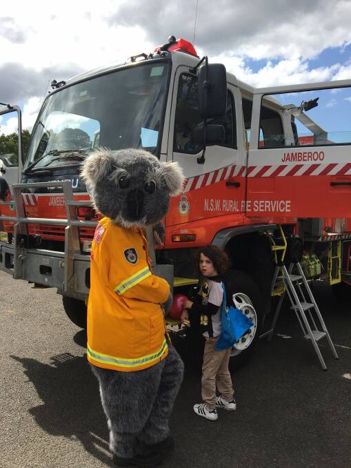 Cullan McInerney and Smokey, the RFS mascot enjoying the open day. 