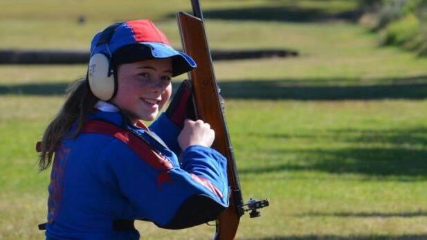New England Girls' School team member Ella (from Moree) finishing her target rifle shooting stage at Hornsby Range. Photo: David Rose
