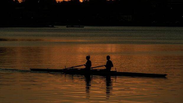 Rowers in the dying days of daylight savings.  Photo: Wolter Peeters

