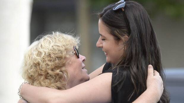  Veronika Taylor, sister of Elvira Buckingham, hugs former Shepparton News reporter Tammy Mills. Photo: Julie Mercer