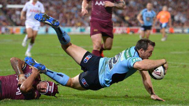 Kiama born and bred: Brett Morris takes on the Queensland Maroons in the first game of the 2014 State of Origin series.
