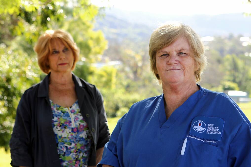 Illawarra seniors group representative Pam Wilson and NSW Nurses and Midwives Association Illawarra delegate Linda Hardman campaigning to keep RNs on duty 24/7 in May last year. Picture: Sylvia Liber