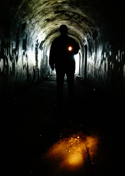 Janette Bryant in the access tunnel at the the old battery under hill 60 at Port Kembla.