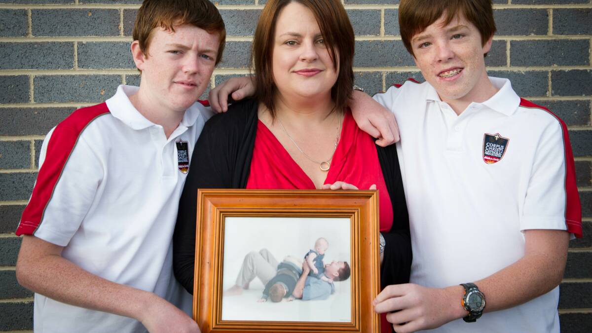 Police officer Robert Brotherson was killed in 2002. Lake Illawarra Police are creating a memorial wall in his and other fallen officers' honours. Pictured are Melissa Brotherson and her sons Ewan and Blake. Picture: ALBEY BOND