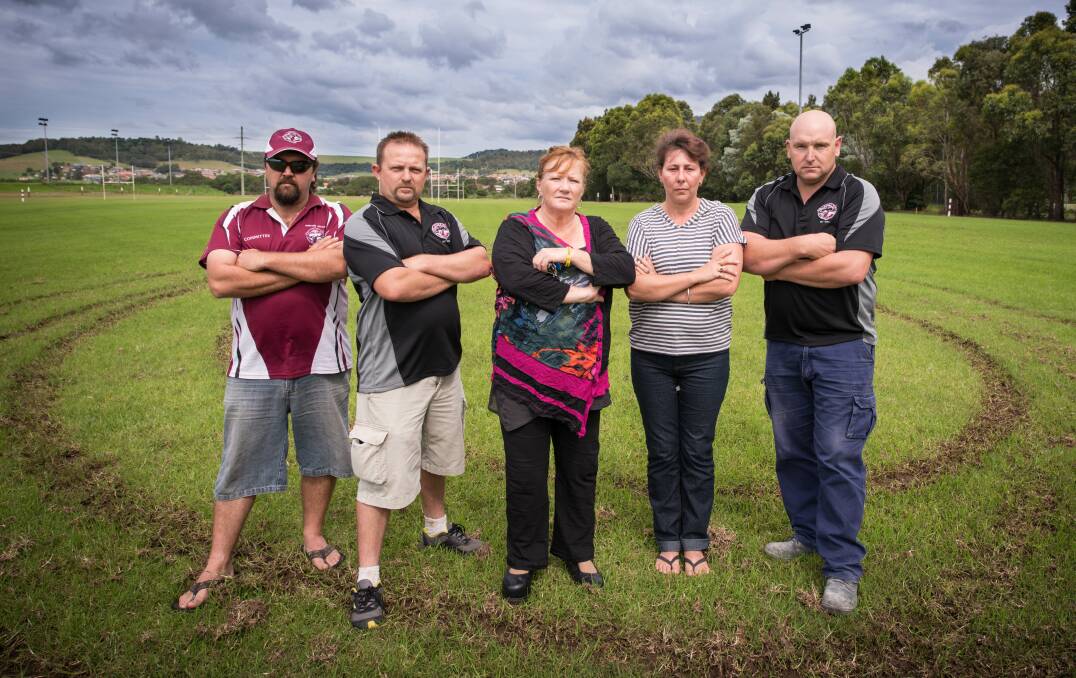 Extensive damage has been done to the junior football fields at Croome Road, Albion Park. Vice-president Sush Noveski, ground manager Paul Till, Shellharbour Mayor Marianne Saliba, committee member Jodi Mounfield and club president of Albion Park-Oak Flats Junior Rugby League Jason Stoker assess the damage. Picture: ALBEY BOND