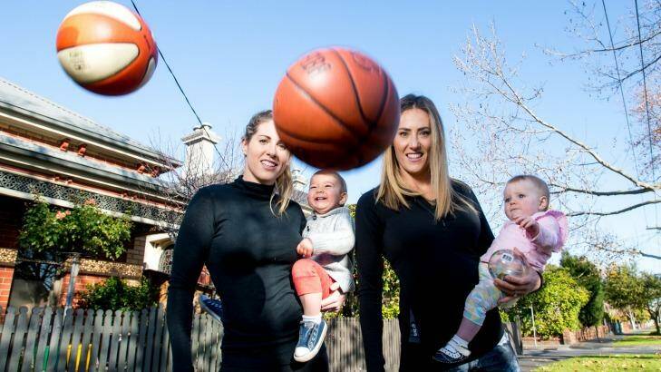 Balls in the air: Basketballer Kathleen Macleod with son Jaxson, and netballer Elissa Kent with daughter Frances. Photo: Justin McManus