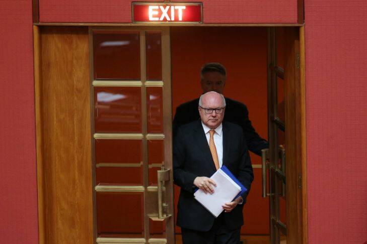 Attorney-General Senator George Brandis arrives to make a statement to the Senate with Finance minister Senator Mathias Cormann at Parliament House in Canberra on Monday 28 November 2016 Photo: Andrew Meares  Photo: Andrew Meares