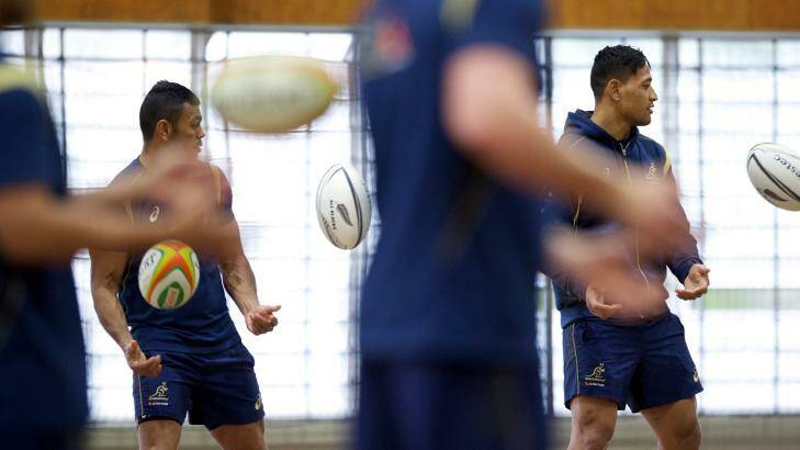 Inside ball ... Kurtley Beale and Israel Folau during an indoor training session on Monday. Photo: Wolter Peeters