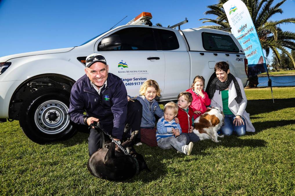 Council ranger Tom Ward with Kiama residents and pooches who are excited about the upcoming Canine Carnival. Vets and dog groomers will also be at the carnival. Picture: GEORGIA MATTS