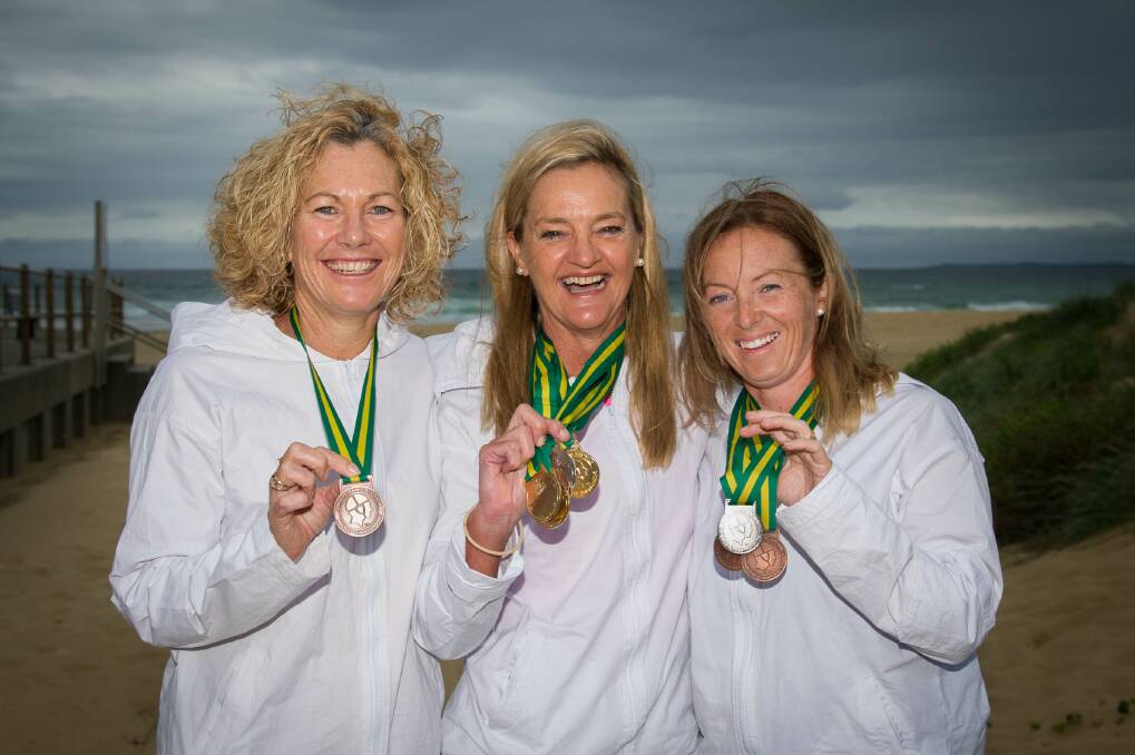 Shellharbour Surf Club's Kerry Perretta, Joanne Helson and Dana Richards show off the medals they won at the recent Australian Surf Lifesaving titles. Picture: ALBEY BOND