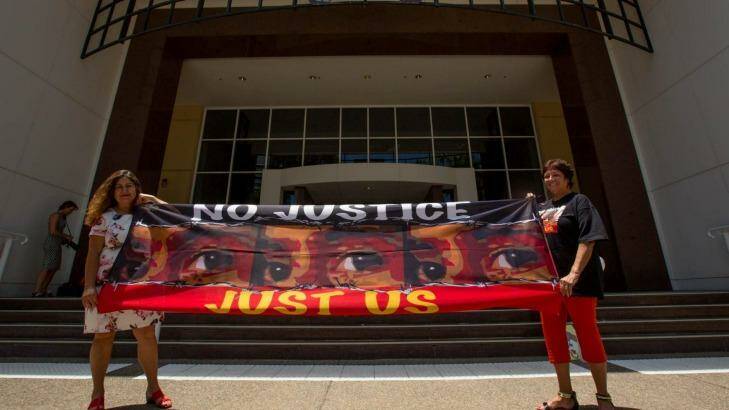 Protesters Theresa Rowe and Josephine Crawshaw outside the royal commission in Darwin.  Photo: Glenn Campbell