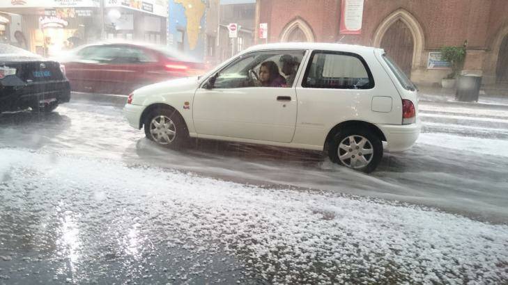 Traffic is backed up in Newtown as the streets become paved with ice. Photo: Tim Biggs