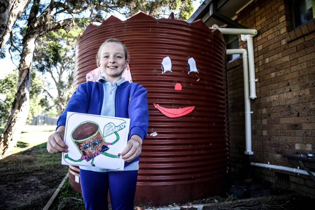 St Paul's Catholic Primary School at Albion Park recently installed a water tank to teach about sustainable practices. Student Rhinna Edwards won the logo competition for "Tanky". Picture: GEORGIA MATTS