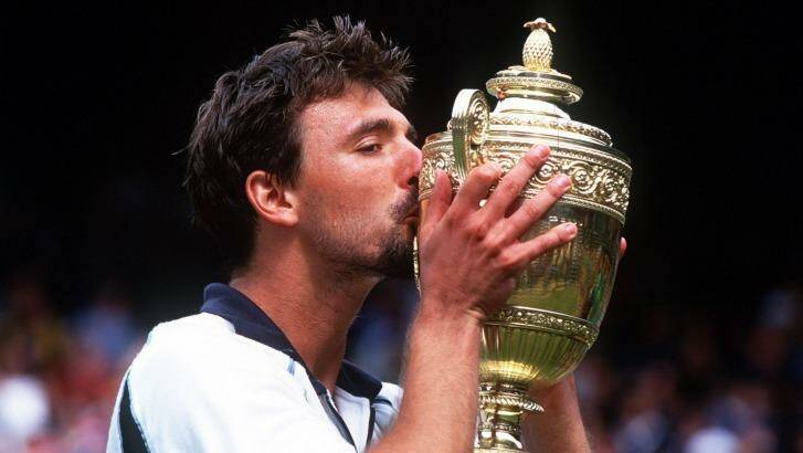 Real wild card: Goran Ivanisevic celebrates the Wimbledon trophy he won in 2001 while ranked No.125 in the world. Photo: Allsport
