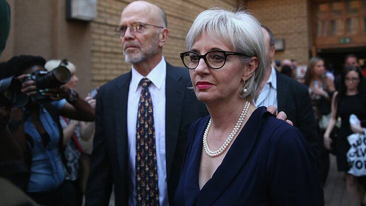 Lois Pistorius and Arnold Pistorius, the aunt and uncle of Oscar Pistorius, leave North Gauteng High Court during the lunch break.