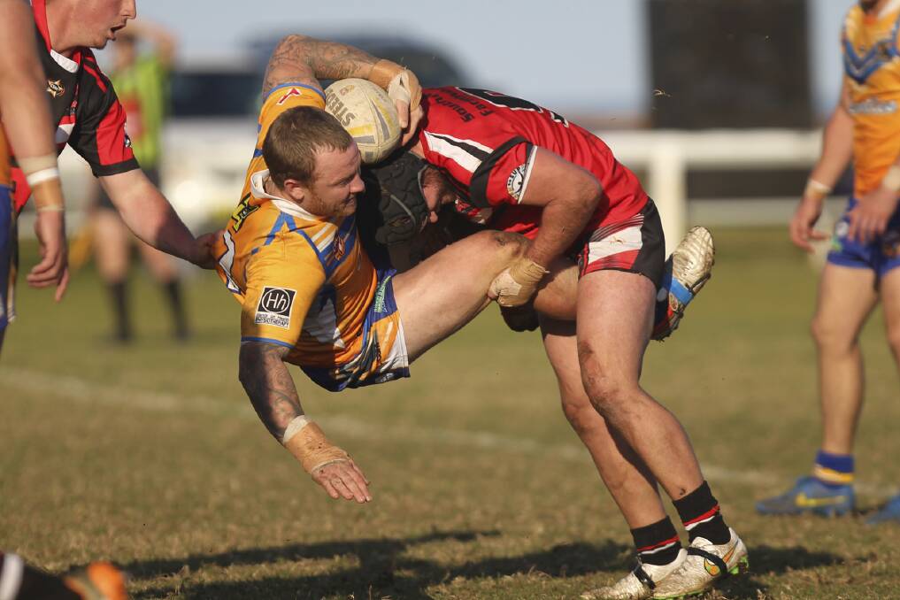 It was a memorable return to the South Coast Rugby League on Sunday for Warilla-Lake South Gorillas' Keiran Rankmore, as he was first welcomed to the Kiama turf by Knights hooker Brent Wake, and minutes later sent off for an alleged high tackle during his side's heroic 16-8 victory. Picture: DAVID HALL