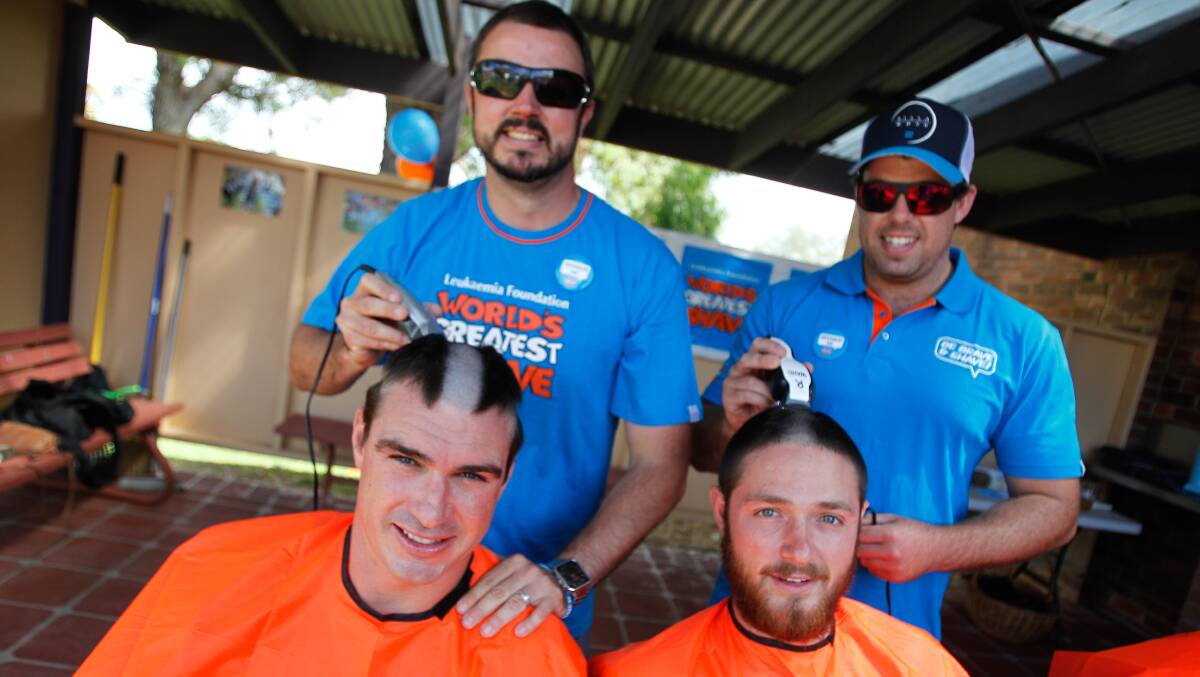 Matt Fownes and Keenan Hobbs shave the heads of Ryan Staples and Keiran Quinn during Gerringong's World's Greatest Shave. Picture: CHRISTOPHER CHAN