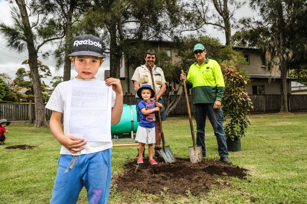 Dashiell King and brother King with Council Tree Management Officer Michael Taylor and worker Arvid Vanags with the letter he sent to council. Picture: GEORGIA MATTS