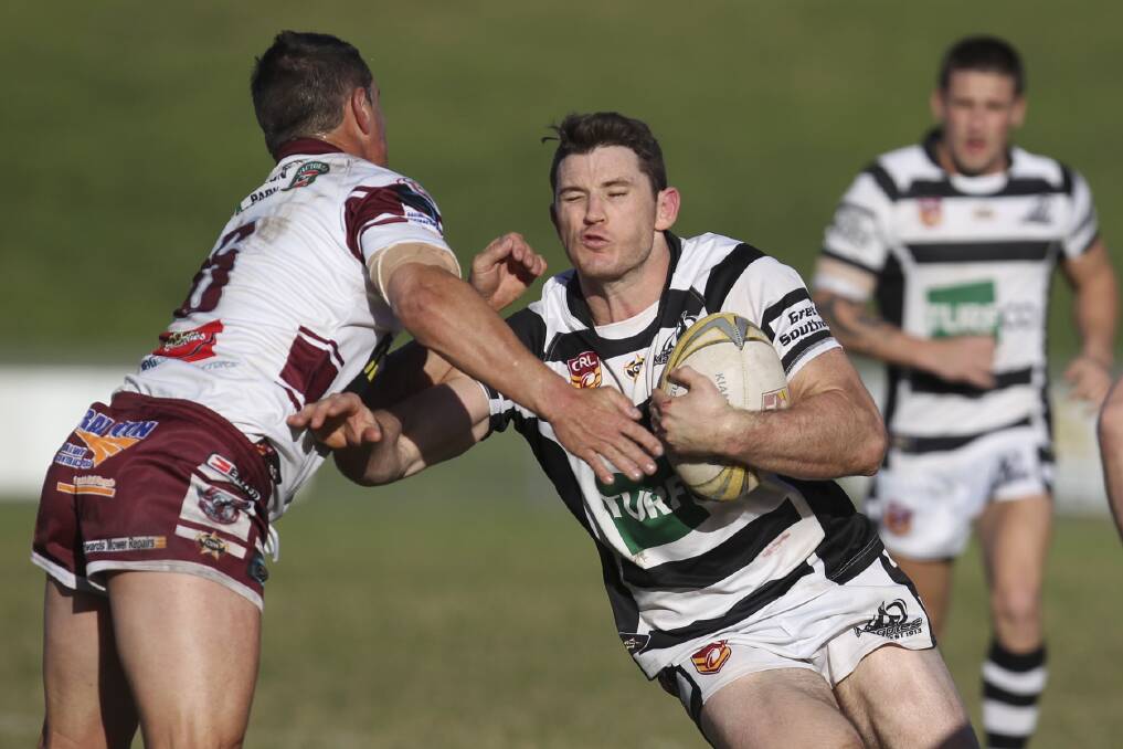 In-form Berry captain-coach Nathan Benny looks to bump off Albion Park's Gary Breakspear during the Magpies' 48-30 win at Centenary Field on Sunday. Picture: DAVID HALL