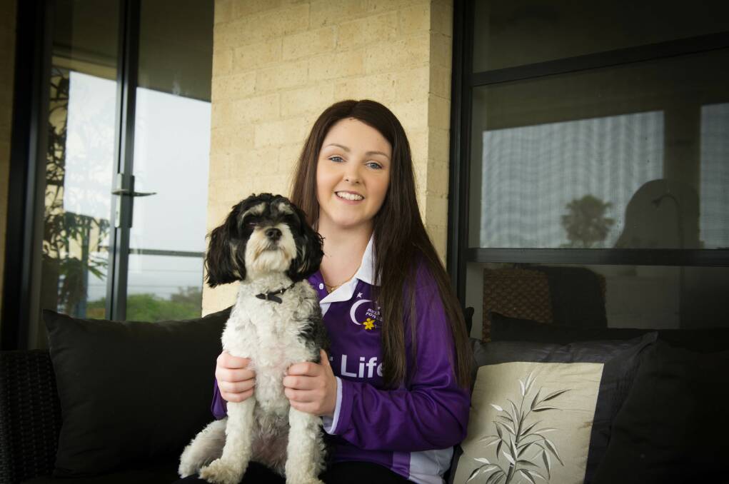 Kiama teenager Ashleigh Collins is urging the community to support this year's Relay for Life event. She is pictured with her dog, Lulu. Picture: ALBEY BOND
