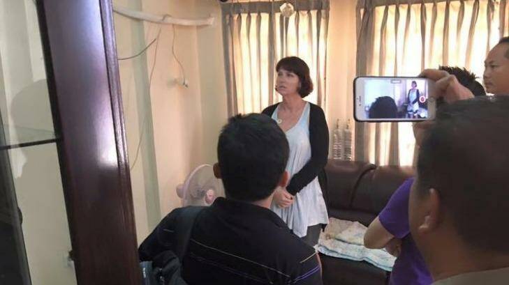 Tammy Davis-Charles being questioned in the Cambodian police office of human trafficking. Photo: Cambodian National Police
