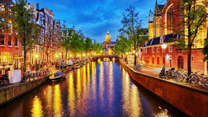 Westerkerk (Western Church), with water canal view in Amsterdam.  Photo: iStock