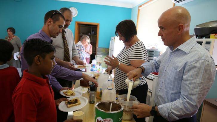 Education Minister Adrian Piccoli (right) at Walgett's breakfast club. Photo: Louise Kennerley