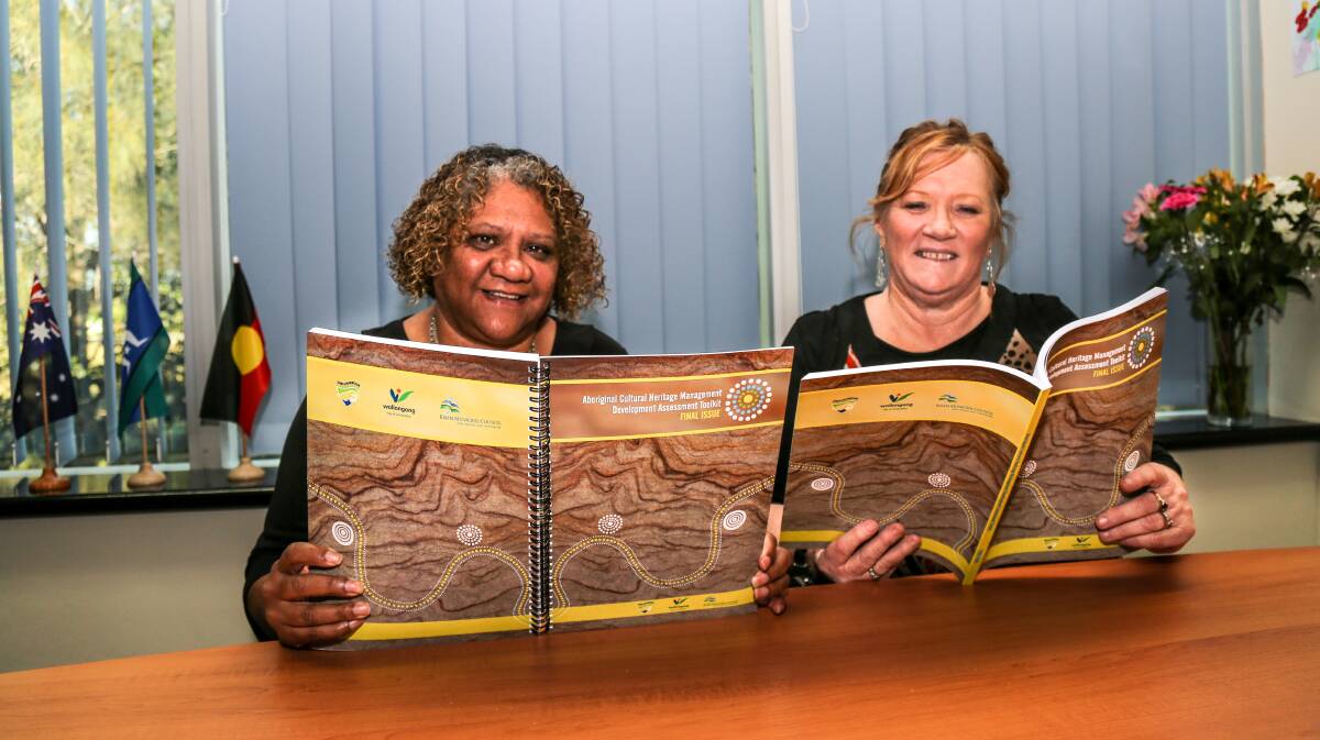 Shellharbour City Council Aboriginal community liaison officer Veronica Bird and Shellharbour Mayor Marianne Saliba with the award-winning Aboriginal Culture and Heritage Development Application Toolkit. Picture: GEORGIA MATTS