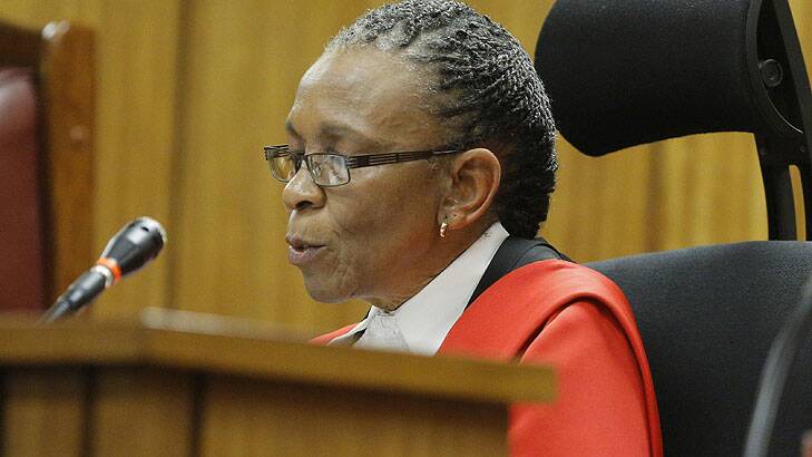 Judge Thokozile Masipa reads her verdict as South African Paralympic athlete Oscar Pistorius (unseen) sits in the dock during the verdict in his murder trial.