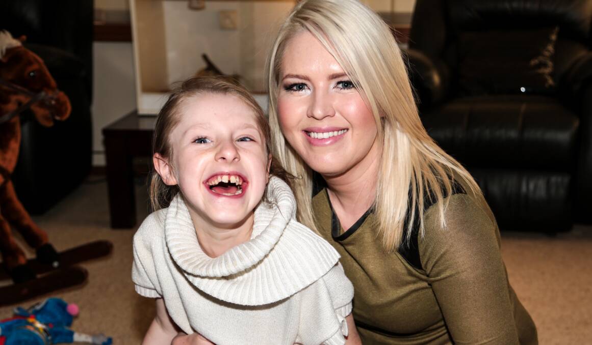 Melissa Smith with her daughter Lili, 10, who suffers from a number of conditions including complete agenesis of the corpus callosum, microcephaly, and epilepsy. Picture: GEORGIA MATTS