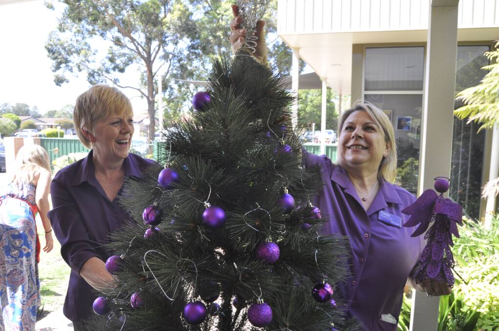 Warrigal employees Karen Larkin and Stella Theologis get ready for the Christmas Craft Fair on Saturday at Warrigal Village Hall, Warilla. Picture: ELIZA WINKLER