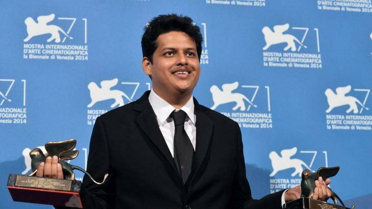 Writer-director Chaitanya Tamhane poses with the Orizzonti Award for Best Film and the Lion of the Future for his movie, Court, at the Venice Film Festival. Photo:  AFP PHOTO / TIZIANA FABI